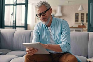 Man using tablet at home