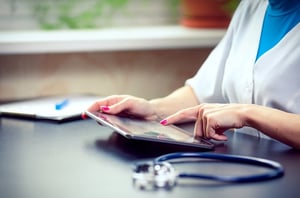 QAPI doctor using tablet