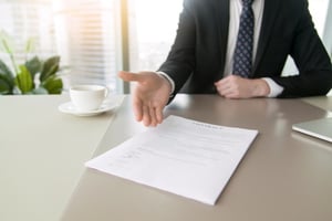 hand pointing at contract